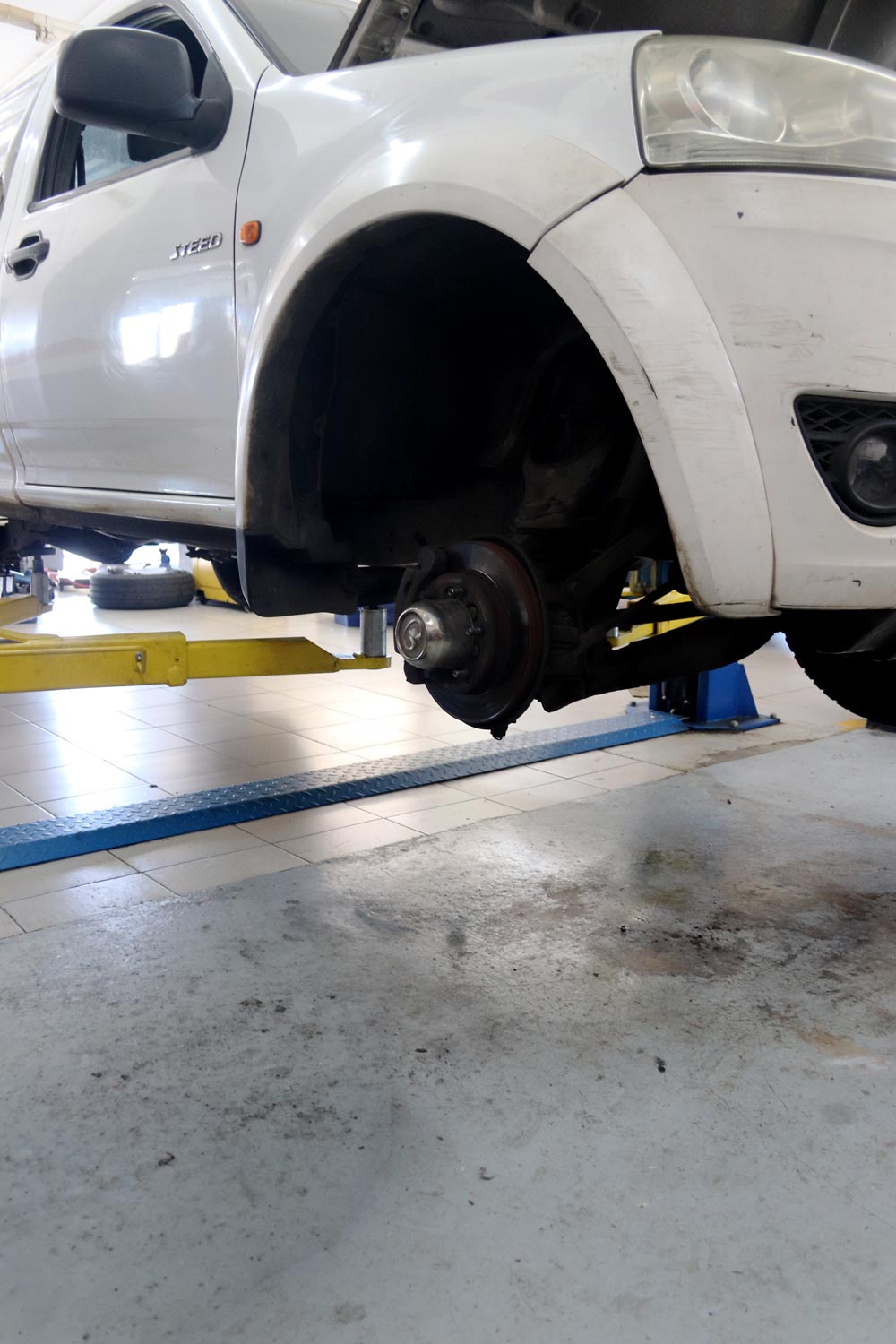 Brake and wheel inspection on a bakkie in the workshop
