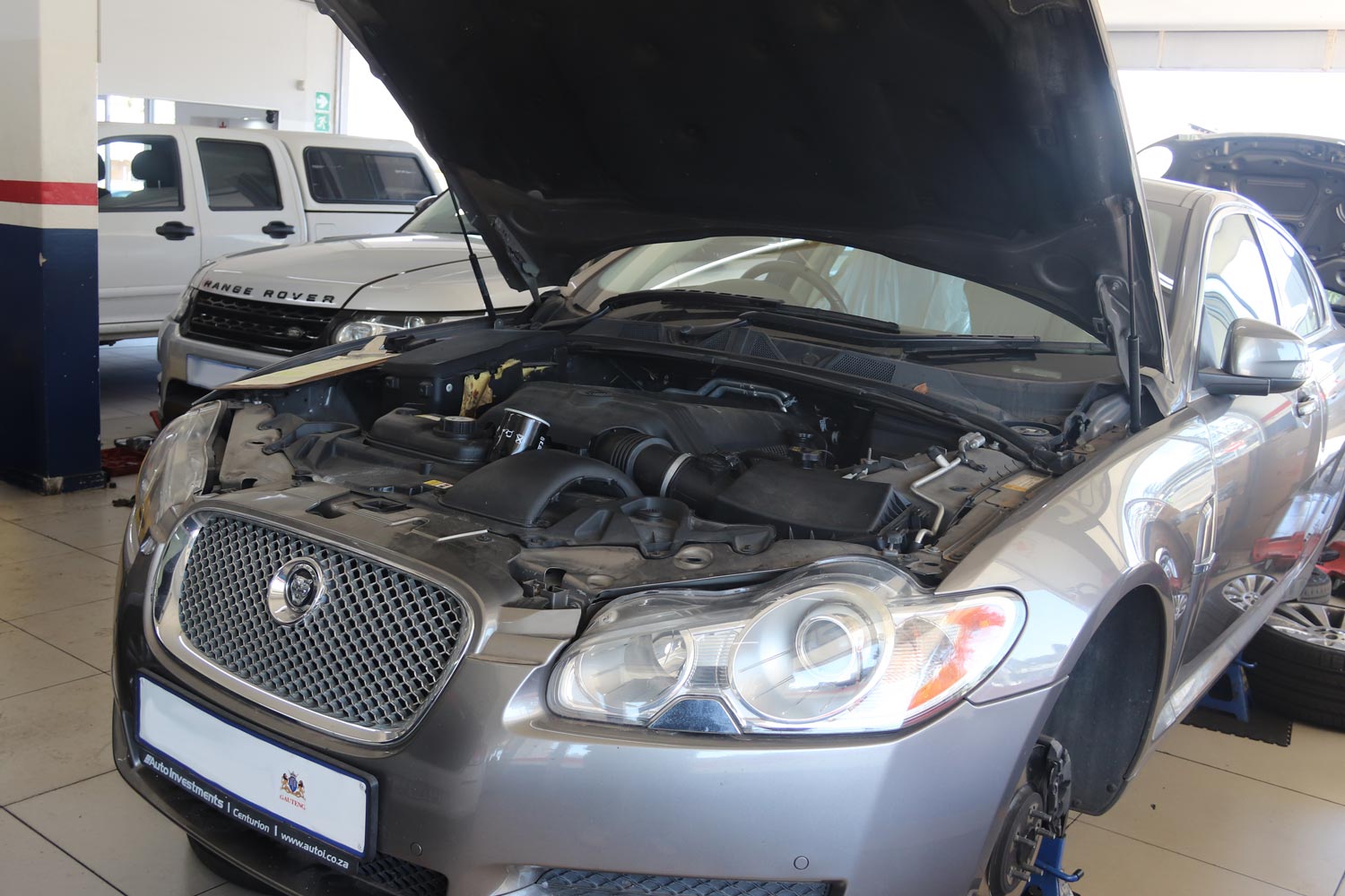 Jaguar XF engine bay open during a major service