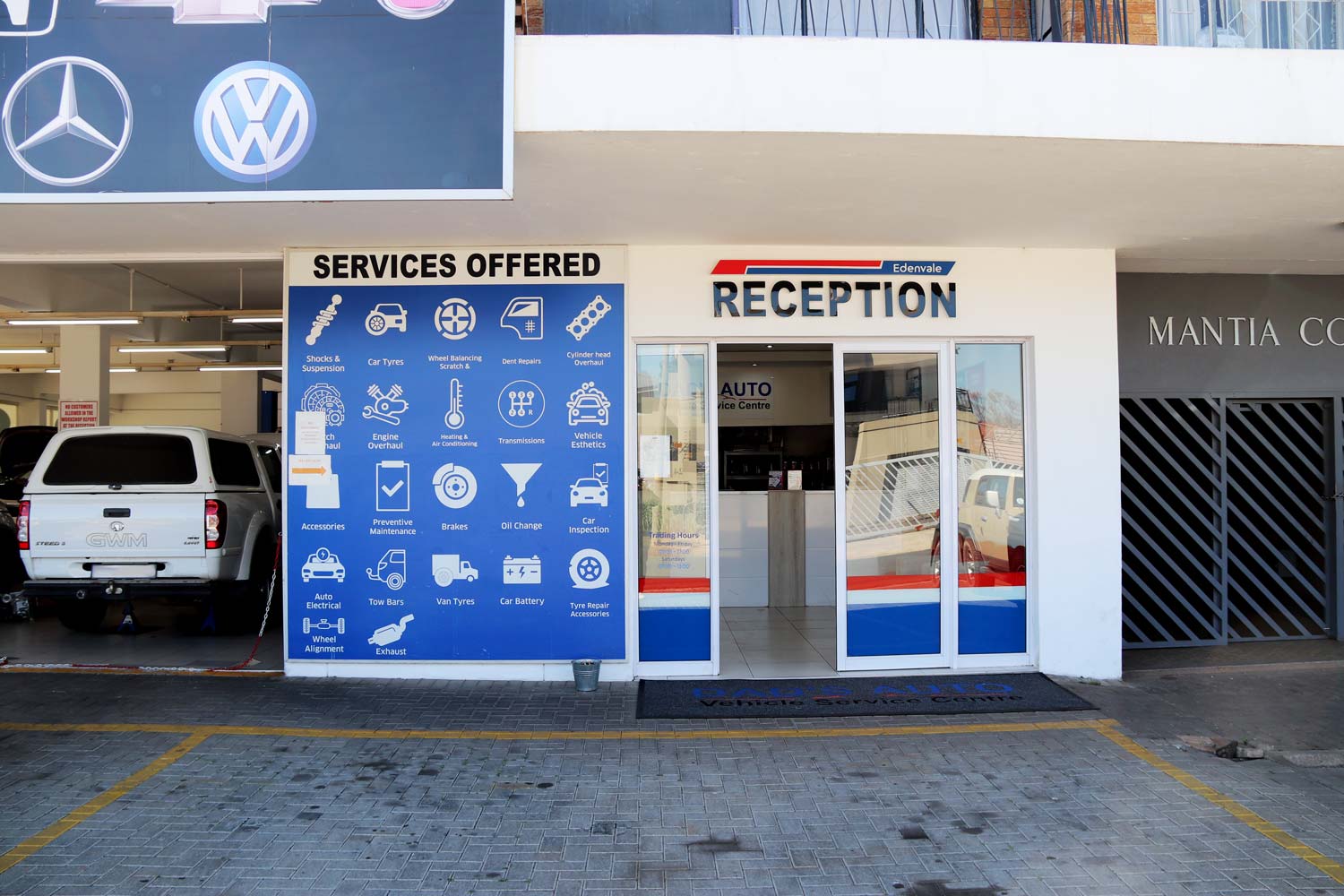 DAD'S Auto reception entrance and services offered board