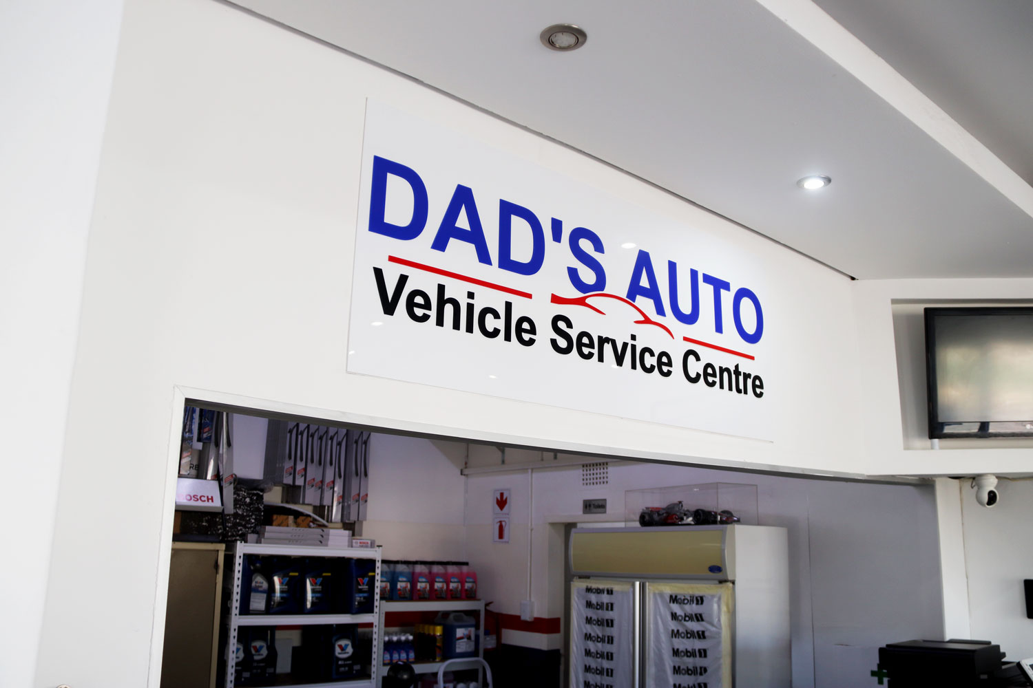 DAD'S Auto Vehicle Service Centre signage inside reception