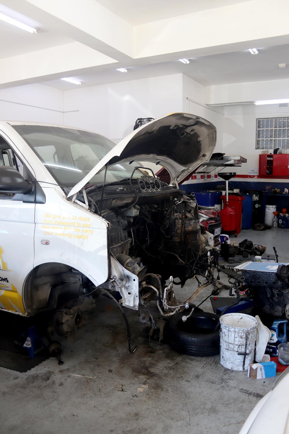 Technicians carrying out an engine overhaul in the workshop